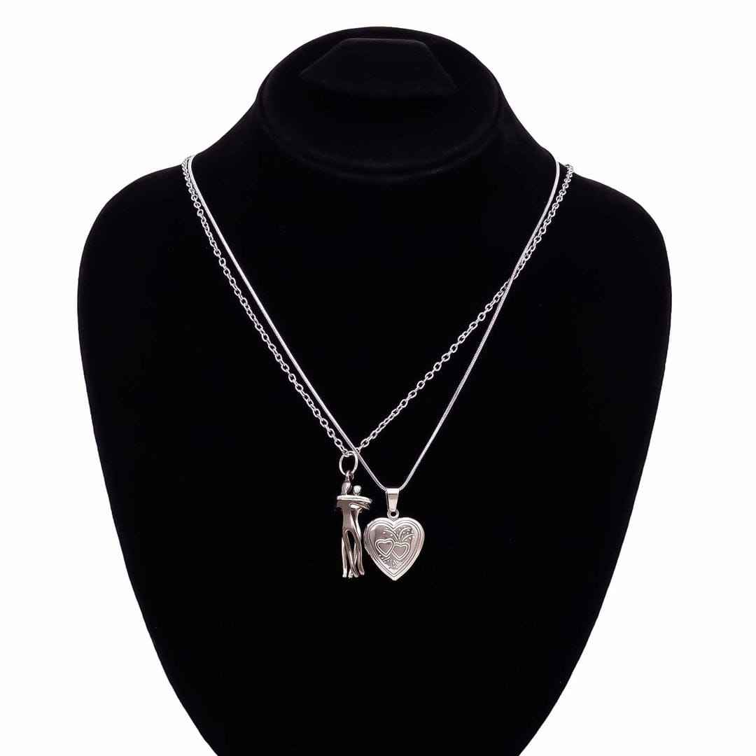 Silver necklace with two pendants on a black mannequin bust.